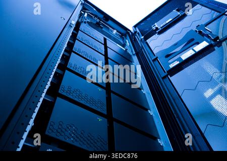A detailed view of a modern data center server rack showcasing advanced technology and efficient design for data storage and management solutions. Stock Photo