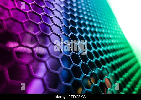 This image showcases a colorful abstract hexagonal mesh pattern with vibrant lighting and smooth textures, perfect for backgrounds and modern designs. Stock Photo