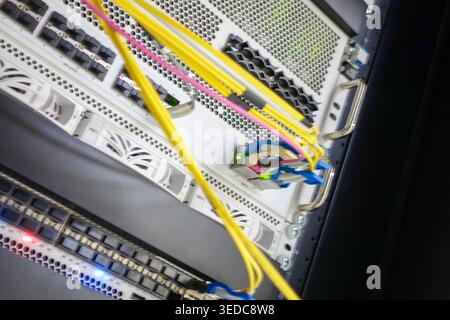Close-up view of a network server showing colorful cables and connections, illustrating modern data center technology and efficient wire management pr Stock Photo