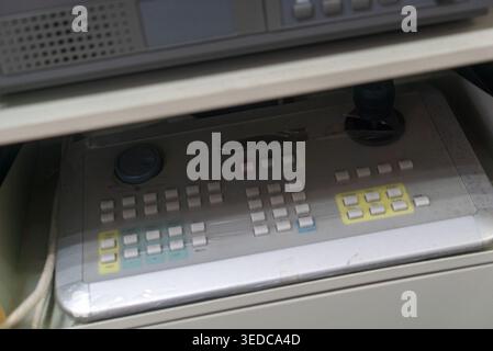 This image captures a control panel featuring an array of buttons and knobs, showcasing a modern interface designed for precise operation in various e Stock Photo