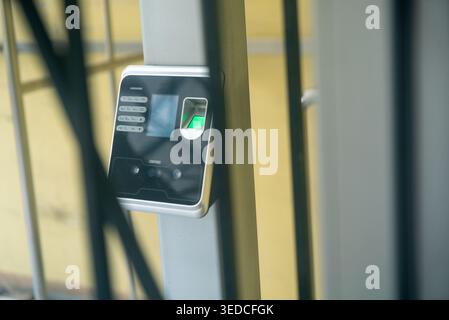 This image features a biometric security access device mounted on a post, showcasing modern technology for entry control and identification. Stock Photo