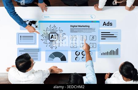 A group of professionals collaborating around a table while analyzing digital marketing strategies powered by AI technology, showcasing data Stock Photo