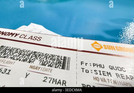 Economy class boarding pass, ticket is for a journey from Phu Quoc (PQC) to Siem Reap (REP) Stock Photo