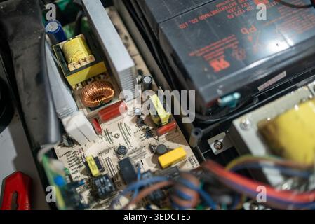 Detailed view of an electronic circuit board showcasing various components such as resistors and capacitors arranged for functional assembly and repai Stock Photo