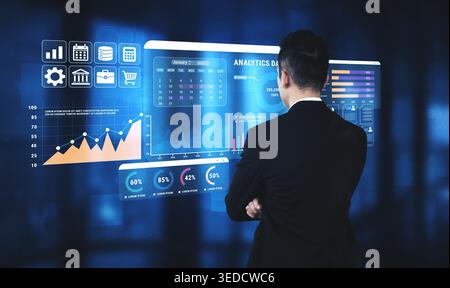 Business Professional Analyzing Data Visualizations on a Virtual Screen in a Modern Office Environment with Graphic Charts and Statistics Haptic. Stock Photo