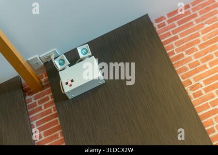 This image shows an indoor alarm system with wall speakers, emphasizing modern technology in home safety and security design. The setup is sleek and f Stock Photo