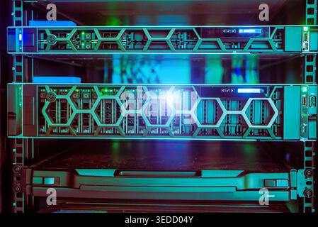 Explore a high-tech data center server rack showcasing advanced server equipment with vibrant lights, symbolizing modern technology and efficient data Stock Photo