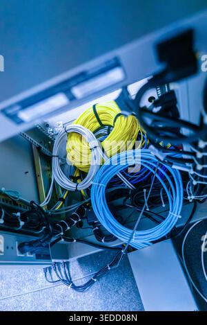View of neatly organized colorful network cables inside a server rack. The image captures the structured wiring essential for data communication and m Stock Photo