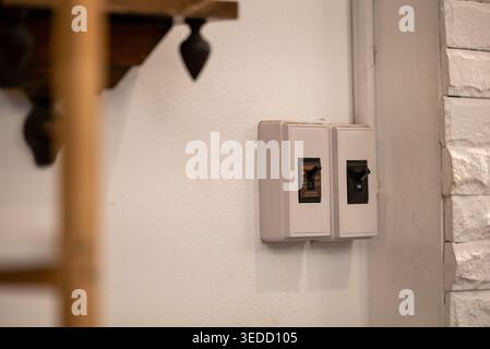 Minimalist wall switches installed in a modern interior. These light control panels enhance functionality while blending seamlessly into the room deco Stock Photo
