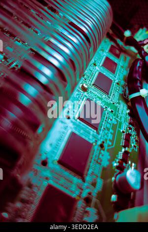 This image showcases a close-up view of intricate circuit board components, highlighting the detailed electronic hardware and connections that power m Stock Photo