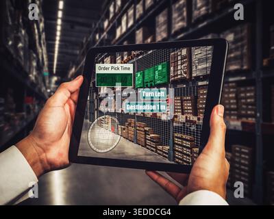 Smart warehouse management system using augmented reality technology to identify package picking and delivery . Future concept of supply chain and Stock Photo