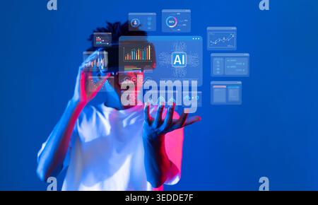 A striking visual showing a person interacting with advanced artificial intelligence data analytics, featuring vibrant graphics and charts that Stock Photo