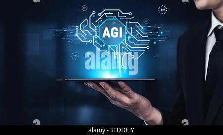 Professional holding tablet displaying AGI concept with glowing brain circuit and technology interface, representing future of artificial intelligence Stock Photo