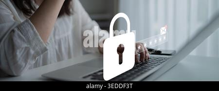 A person works on a laptop with a visible digital lock symbol, highlighting themes of online security and data protection in a contemporary workspace Stock Photo