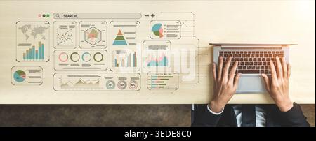 Modern business analysis and data visualization concept with hands on laptop and charts on wooden desk showcasing insights and search tools for Stock Photo