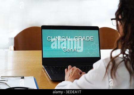clinical-grade genAI. Artificial intelligence and medicine concept. Health professional woman typing on her laptop. Stock Photo