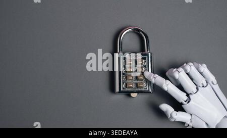 Robot finger pressing numbers on a silver combination padlock on a grey background for AI security access and code breaking concepts. Stock Photo