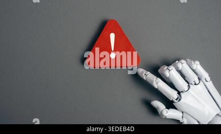 Robot Hand Touching Red Warning Exclamation Mark Sign for Artificial Intelligence Error and Machine Learning Risk Concept Stock Photo