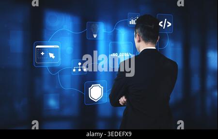 Businessman Analyzing Digital Interface with No Code Solution Icons in Modern Office Environment Quark. Stock Photo