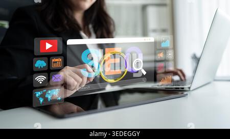 Business Professional Enhancing Search Engine Optimization Using Laptop with Interactive Data Visualization and Analysis Tools Ledger. Stock Photo
