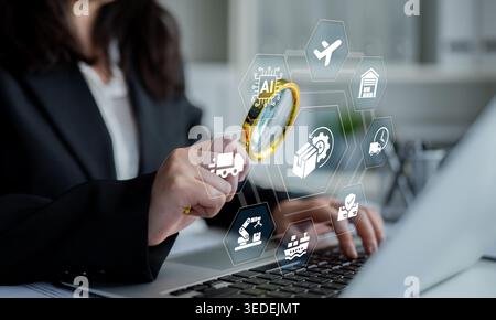 A professional woman focuses on analyzing digital icons representing logistics and tech trends while using a magnifying glass over a laptop in an Stock Photo