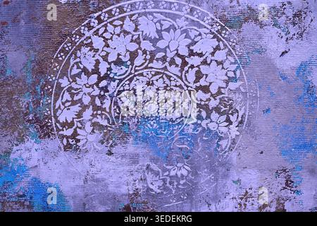 Abstract floral mandala on textured purple blue painted background Stock Photo