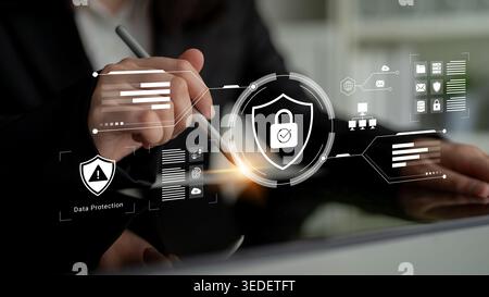 A conceptual image illustrating data protection and cyber security with a hand holding a pen over a digital workspace showcasing modern graphics and Stock Photo