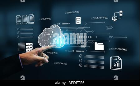 A professional hand interacting with digital cloud technology, illustrating data management and innovative concepts in a modern business environment Stock Photo