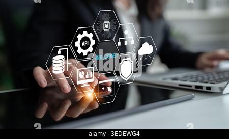 Business Professional Engaging with Digital No-Code Technology Icons in a Modern Office Environment, Showcasing Data Management and Cloud Solutions Stock Photo
