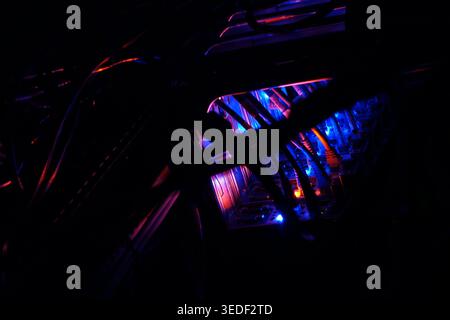 This abstract image features illuminated electronic circuits with vibrant colors. The intricate details showcase a connection between technology and a Stock Photo