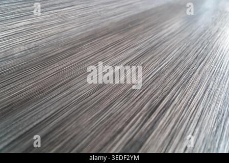 This image showcases an abstract texture featuring grayish vertical lines. The design conveys a sleek and modern aesthetic perfect for various artisti Stock Photo