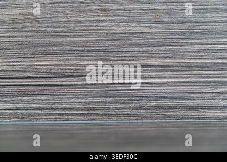 Close-up view of abstract gray wood paneling showcasing intricate textures and lines, perfect for backgrounds in modern design or interior decoration Stock Photo