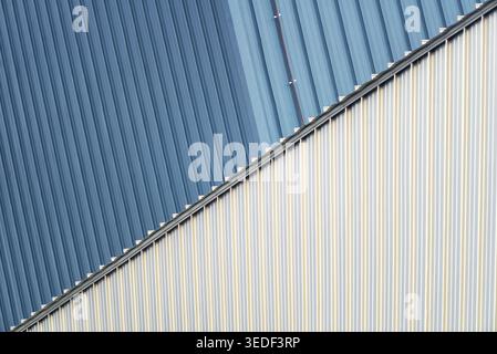 The image features a modern industrial roof showcasing a striking color contrast with sleek lines and textures, emphasizing contemporary architectural Stock Photo