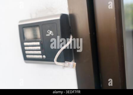 A modern security intercom system featuring a keypad and card reader for enhanced access control. Ideal for buildings and homes seeking reliable entra Stock Photo