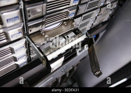 Close-up of advanced storage system in a data center. The image showcases the intricate design of server racks, emphasizing technology and efficiency Stock Photo