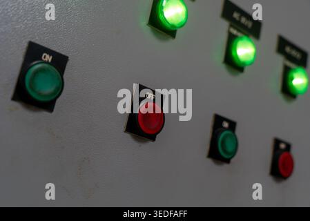 Close-up view of a control panel showcasing colorful buttons and LED indicators. The panel represents modern technology and operational functions used Stock Photo