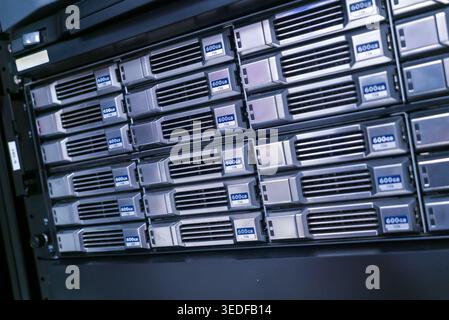 Close-up view of a high-performance data storage server rack featuring multiple units, designed for efficient data management and processing in IT env Stock Photo