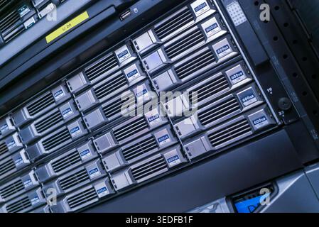 Close-up view of a high-tech server rack featuring multiple servers. This image showcases modern data management and infrastructure essentials for IT Stock Photo