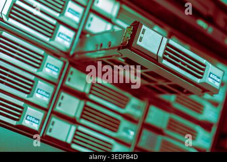A close-up view of modern data storage server drives showcasing efficiency and technology in digital information management and backup solutions. Stock Photo