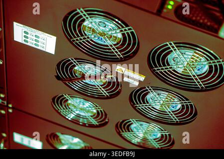 This image showcases high-tech cooling fans used in server equipment within a data center, highlighting technology's role in maintaining optimal tempe Stock Photo
