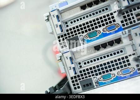 Close-up shot of computer server connections showcasing ports and cables, highlighting the essential technology in modern data infrastructure. Ideal f Stock Photo