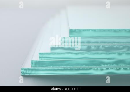 Stack of glass sheets on light background, closeup Stock Photo