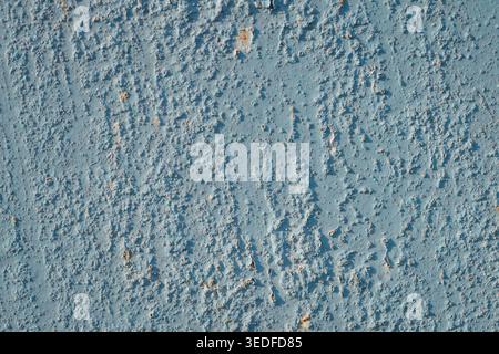 Light blue painted metal texture with small rust spots and peeling surface Stock Photo