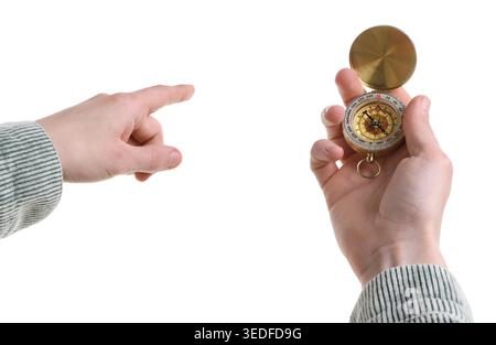 Man with compass pointing in direction on white background, closeup Stock Photo