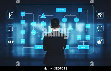 Businessman Analyzing Advanced Flowchart on Digital Interface in Modern Office Environment with Graphical Elements and Data Visualization Techniques Stock Photo
