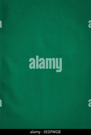 Solid dark green paper texture with a subtle grain. Minimalist background featuring a clean surface and a torn paper edge effect for professional grap Stock Photo