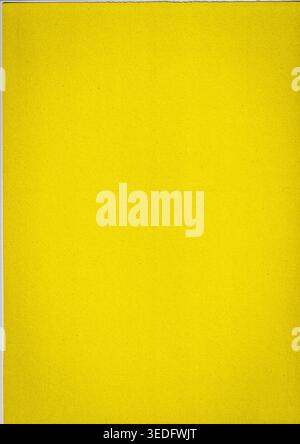 Solid bright yellow paper texture with a fine grain. Minimalist background featuring a clean surface and a torn paper edge effect for professional gra Stock Photo