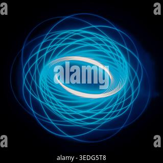 Abstract geometric light painting created with glowing blue circular patterns against a dark black background. Long exposure photographic artwork feat Stock Photo