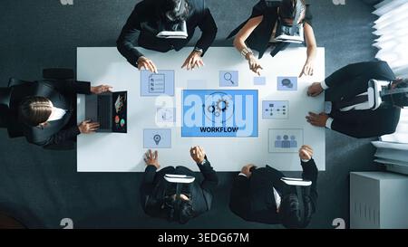 A dynamic business team actively collaborating in a modern office setting, utilizing virtual reality technology to enhance their workflow and Stock Photo