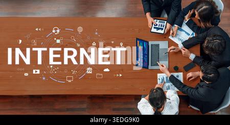Team Collaboration on Digital Marketing Strategies with Laptop and Charts, Visual Representation of Internet and Technology Concepts Haptic. Stock Photo